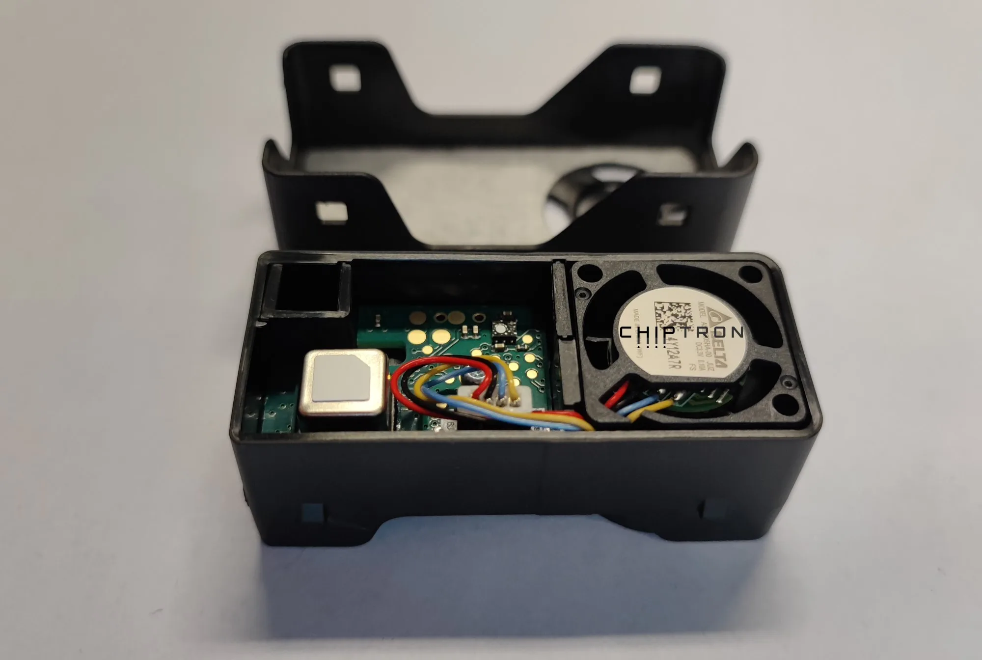 Disassembled SEN66 module showing the circuit board and internal sensors