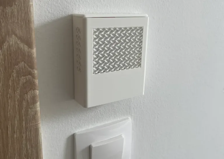 3D printed box full of sensors for measuring air quality with Wi-Fi, Bluetooth, and open-source firmware.
